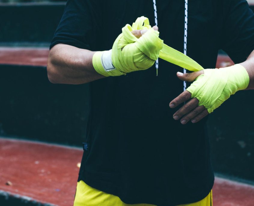 Boxer bandages around their arms ready to fight.
