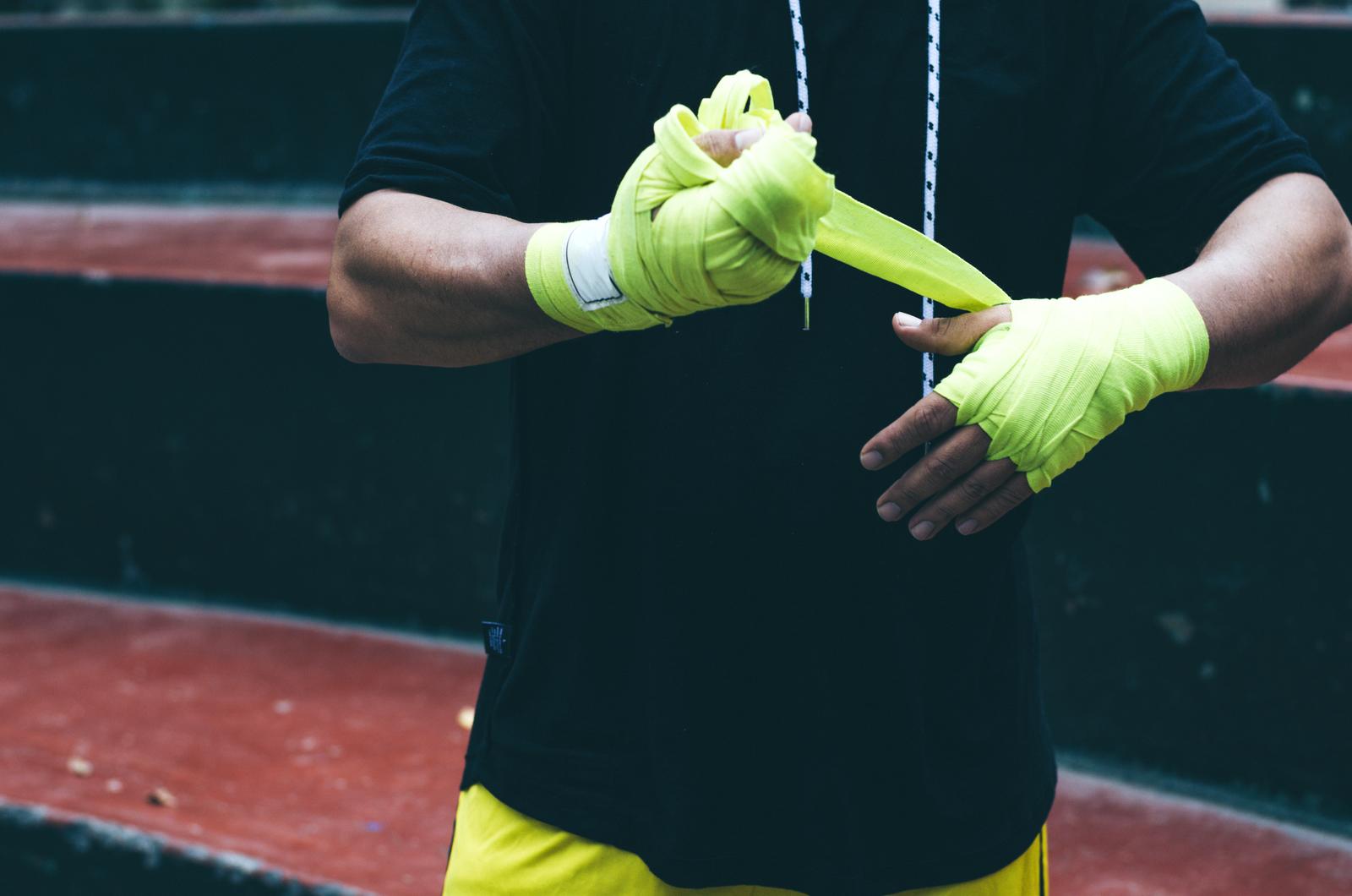 Boxer bandages around their arms ready to fight.